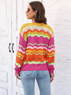 Crochet cardigan with rainbow chevron pattern in pink, orange, yellow, and green.