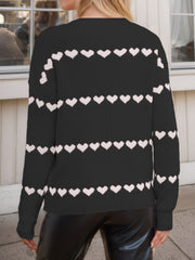 Black knit sweater with white heart stripes, long sleeves, crew neck.
