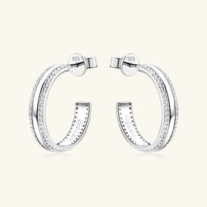 Silver pavé moissanite C-hoop earrings in sterling silver with detailed inner engraving.