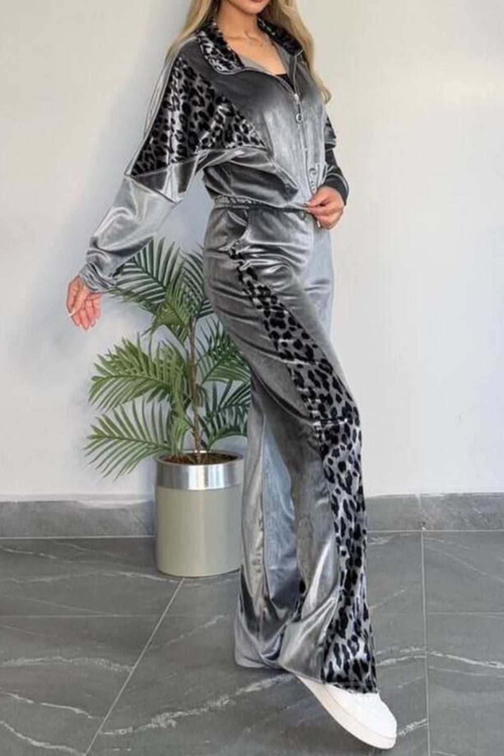 Gray velvet tracksuit with leopard print panels on jacket sleeves and pants.