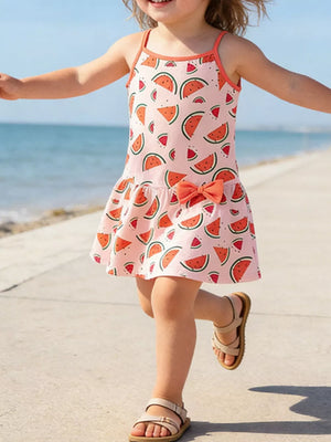 Toddler pink cotton sundress with watermelon print and orange trim, featuring a bow detail.