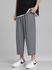 Men's Full Size Loose Fit Cropped Pants in White, model styling view