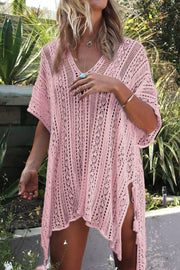 Dusty pink open-knit V-neck beach cover-up with side slits and tassels.