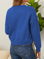 Royal blue V-neck cardigan with daisy embroidery and button front.