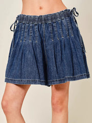Dark blue denim-effect shorts with ruched waist and drawstring ties.