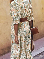 Floral wrap midi dress with ruffled shoulders and a brown belt