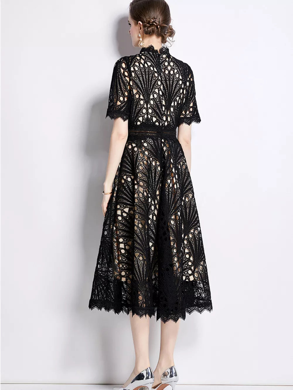 Black lace midi dress with delicate sleeves and a-line skirt.