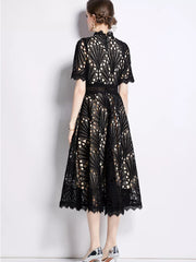 Black lace midi dress with delicate sleeves and a-line skirt.