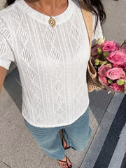 White textured knit maternity t-shirt with crew neck and diamond pattern detail.
