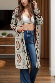 Southwestern print duster cardigan in brown with geometric patterns, open front, long sleeves, and a flowing cut.