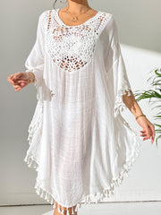 White crochet yoke tassel kaftan dress with wide sleeves and a relaxed fit.