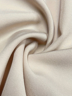 Beige cropped puff-sleeve top & wide-leg set fabric detail