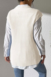 Ivory textured knit V-neck sleeveless top over a white button-down shirt.