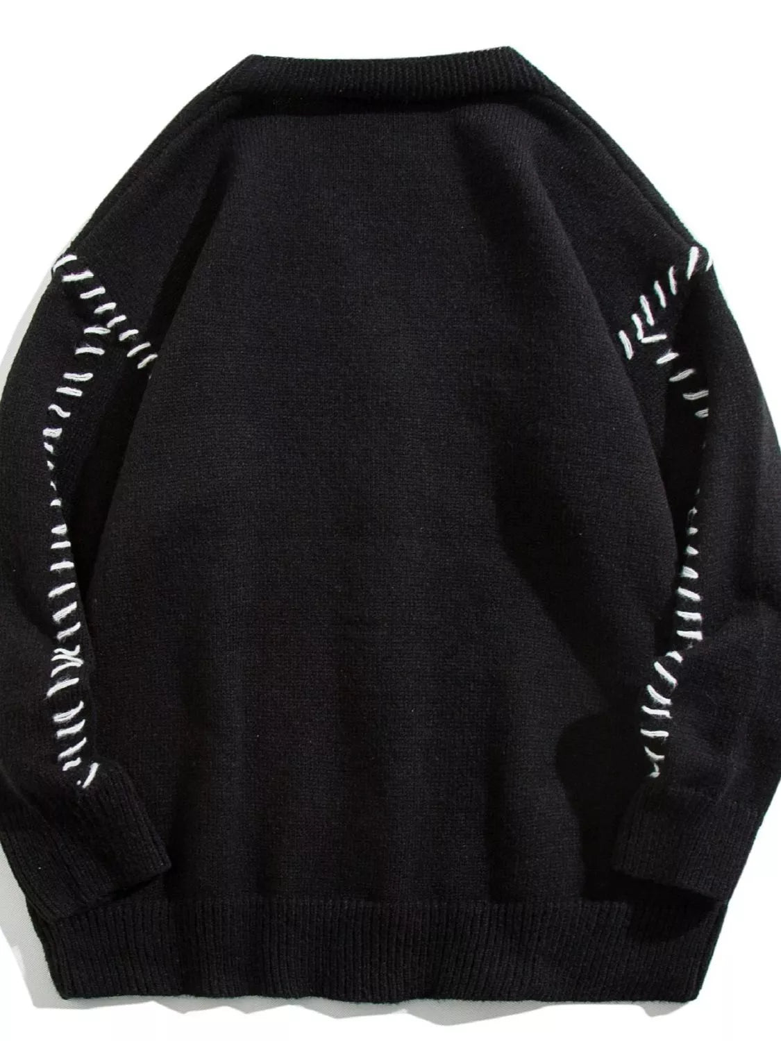 Black ribbed knit cardigan with white contrast stitching detail on sleeves and shoulders.