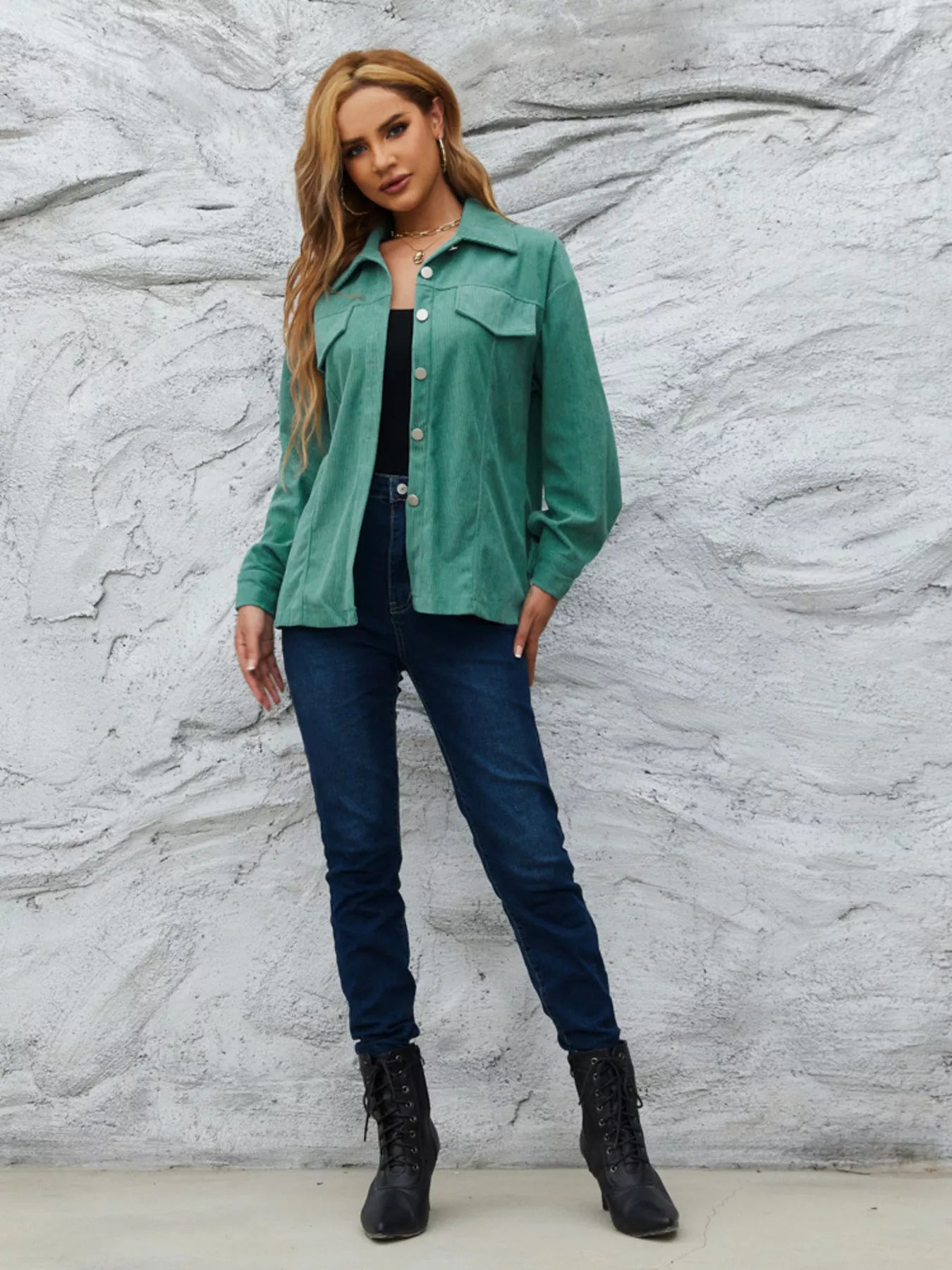 Textured corduroy button-up jacket in Peacock Green with chest pockets and silver buttons.