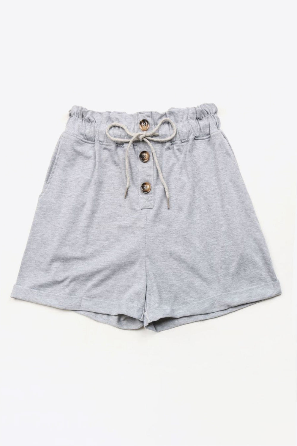 Light gray paperbag waist shorts with button front and drawstring tie.