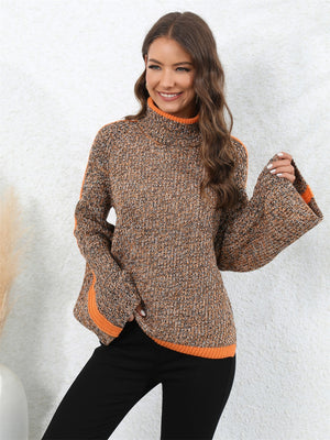 Colorblock raglan sleeve turtleneck knit sweater in brown and orange with bell sleeves.