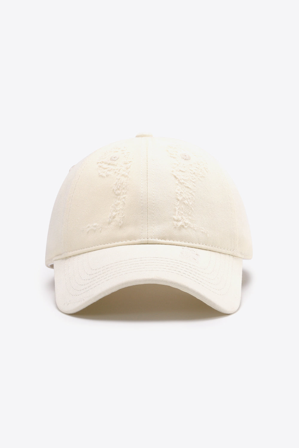 Cream baseball cap with distressed details and curved brim