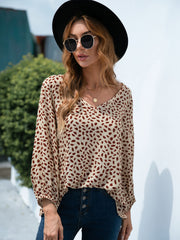 Beige dotted print blouse with balloon sleeves and V-neck