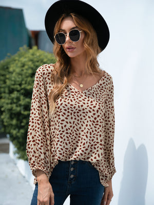 Beige dotted print blouse with balloon sleeves and V-neck