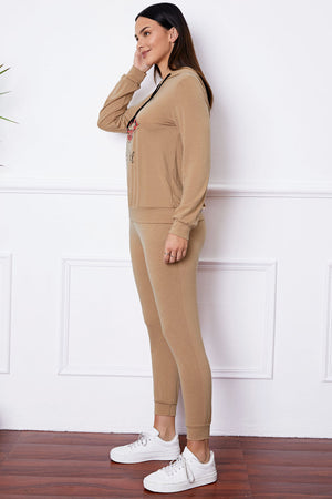 Khaki loungewear set with graphic hoodie and joggers.
