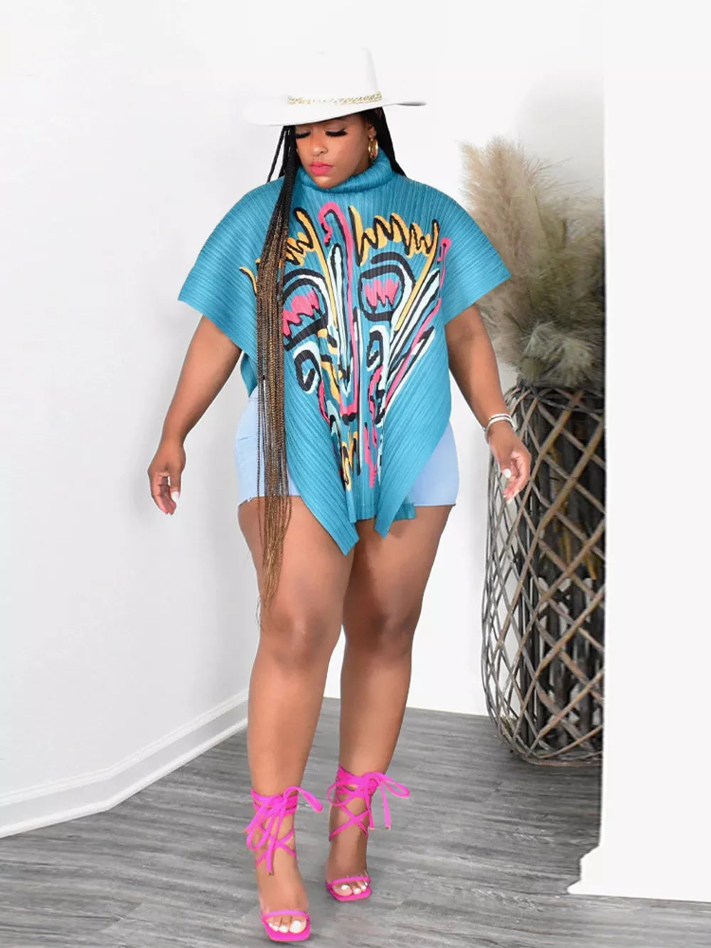 Light Blue abstract print cape shirt with pleated polyester fabric and a turtleneck.