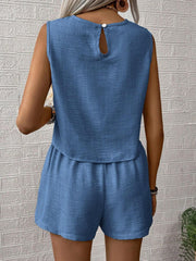 Blue textured linen tank top with keyhole back and matching elastic waist shorts.