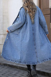 Longline blue denim jacket with pockets and a frayed hem, worn open.