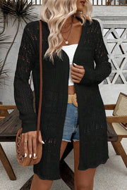 Black openwork crochet duster cardigan with long sleeves and an open front.