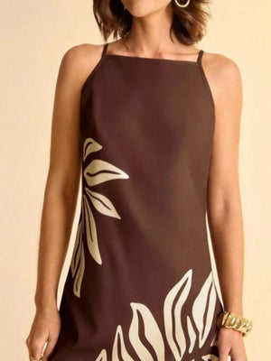 Brown mini dress with cream tropical leaf print, square neck and thin straps.