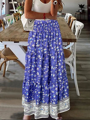 Blue floral maxi skirt with tiered ruffles and border print hem.
