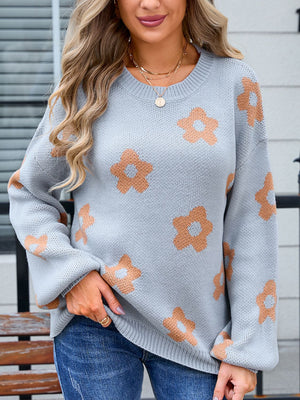 Gray knit sweater with all-over floral print and crew neck.