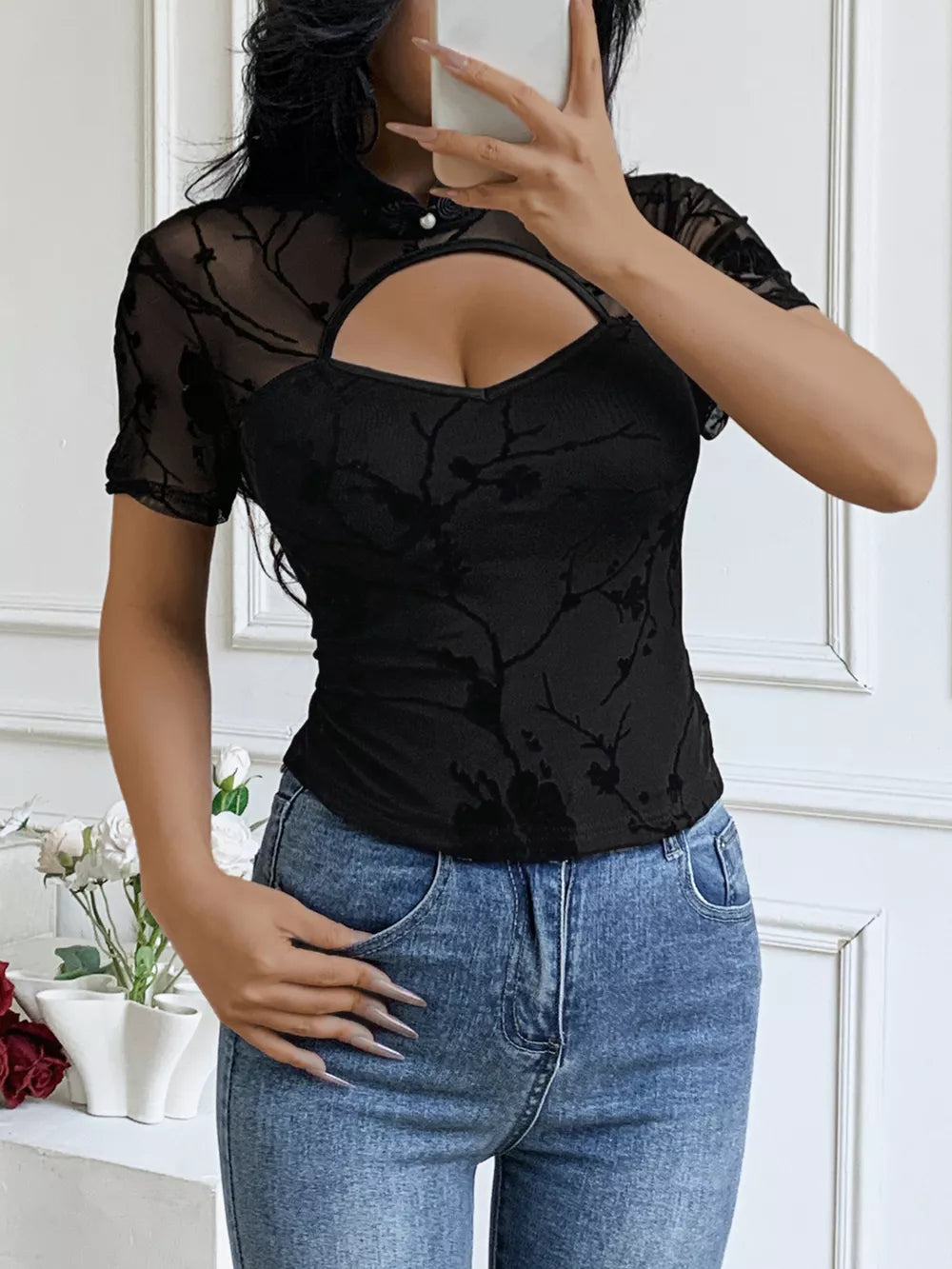 Black mesh t-shirt with cutout and mandarin collar, short sleeves, floral pattern
