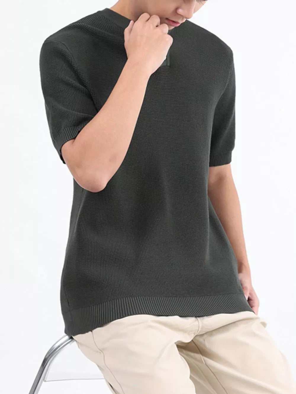 Men's textured knit short sleeve henley in Army Green with a quarter zip neckline.