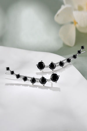 Black Diamond Ear Climbers with silver metal setting and multiple black stones.