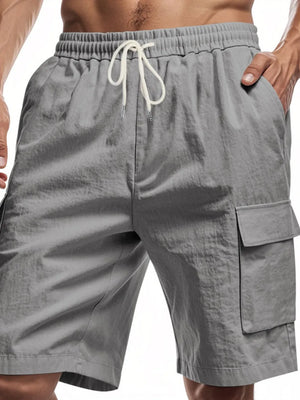 Dark gray relaxed fit drawstring shorts with utility cargo pocket and elastic waistband.