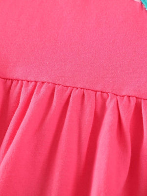 Strawberry pink cotton dress with ruffled hem and bird appliques detail.
