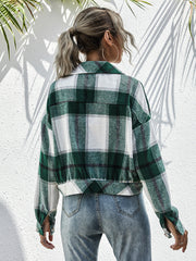 Cropped dark green plaid shacket with button front and patch pockets.