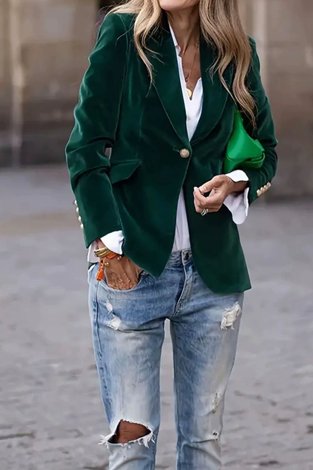 Emerald velvet blazer with gold buttons and a single button closure.