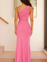 Pink one-shoulder maxi dress with cutout detail and ruched bodice.