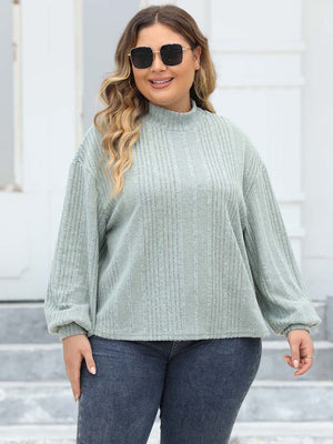 Textured mock neck sweater in Gum Leaf with balloon sleeves and ribbed detail