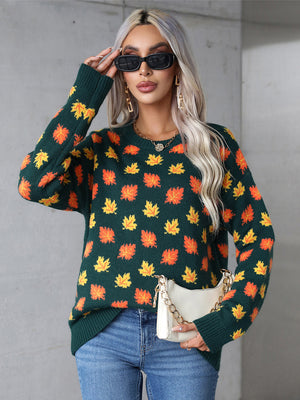Dark green acrylic knit crewneck sweater with all-over orange and yellow leaf motif.