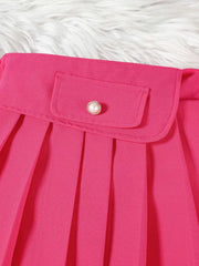Pink baby skirt with pleated detail and decorative button on pocket.