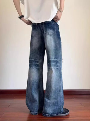Men's distressed wide-leg jeans with pockets in a blue wash.