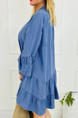 Tiered denim babydoll mini dress in medium with bell sleeves and ruffled hem.