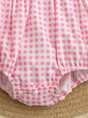 Baby pink gingham one-piece with snap closure and elastic leg openings.