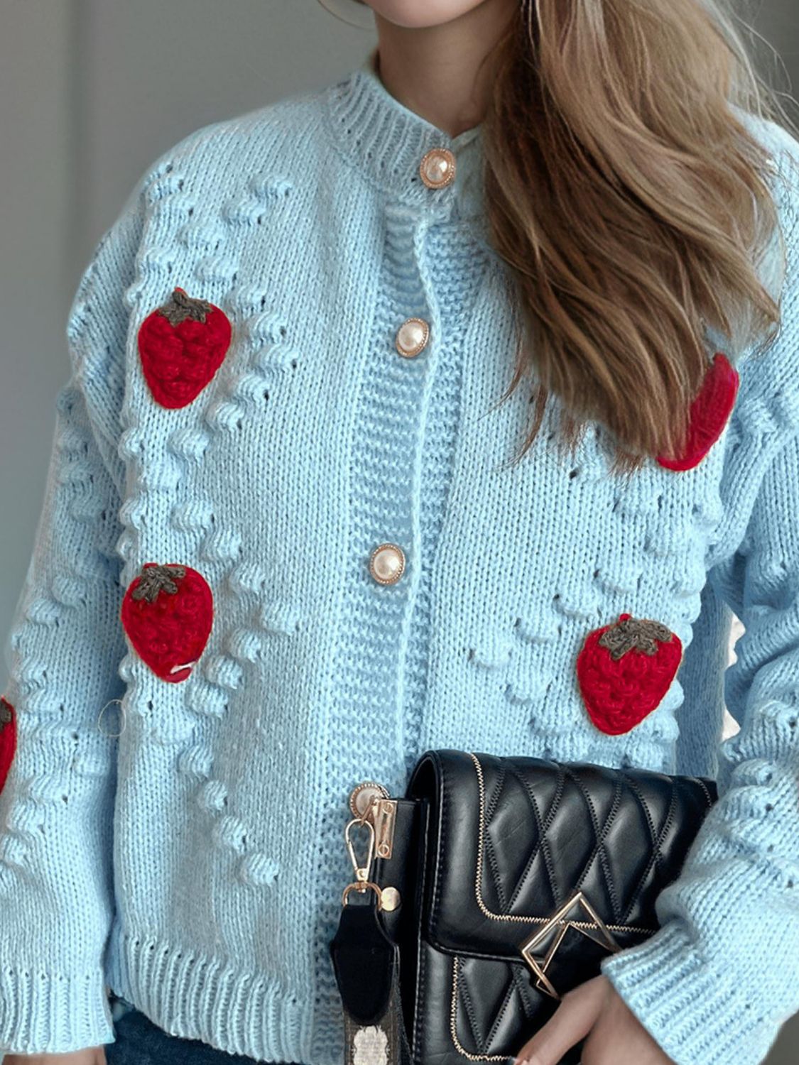Pastel blue knit cardigan with strawberry appliques and pearl buttons
