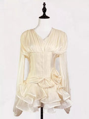 Elegant white ruffled mini dress with corset waist and long sheer sleeves.