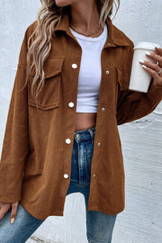 Brown waffle knit overshirt with patch pockets and white buttons, worn open over a white crop top.