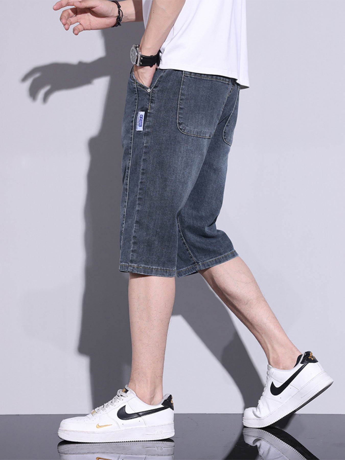 Men's classic denim shorts in Dusty Blue, featuring a button closure and casual cut.